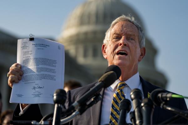 Wilson holds up a copy of a letter sent to President Biden during a news co<em></em>nference outside of the Capitol on Sept. 9, 2024.
