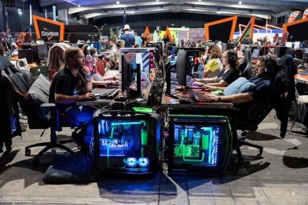Videogamers taking part in part in competition.