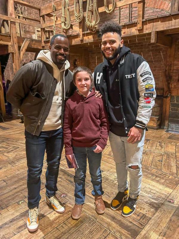 Riker posing for a picture with actors from 