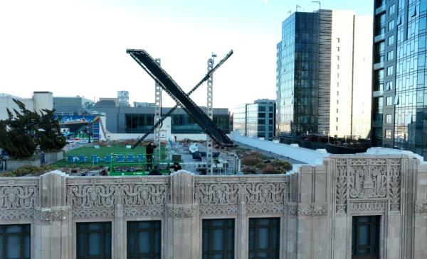 Workers install a large X on the roof of the former Twitter headquarters on July 28, 2023 in San Francisco, California. 