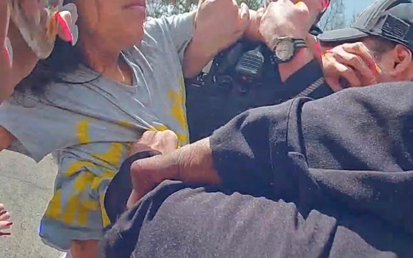 Migrant blocks Yo<em></em>nkers cops. 