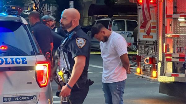 One person was seen in handcuffs. 