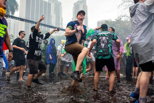 Maxine St-Amour Bélanger dancing in ankle-high rainwater during the Ultra music festival in downtown Miami on March 22, 2024
