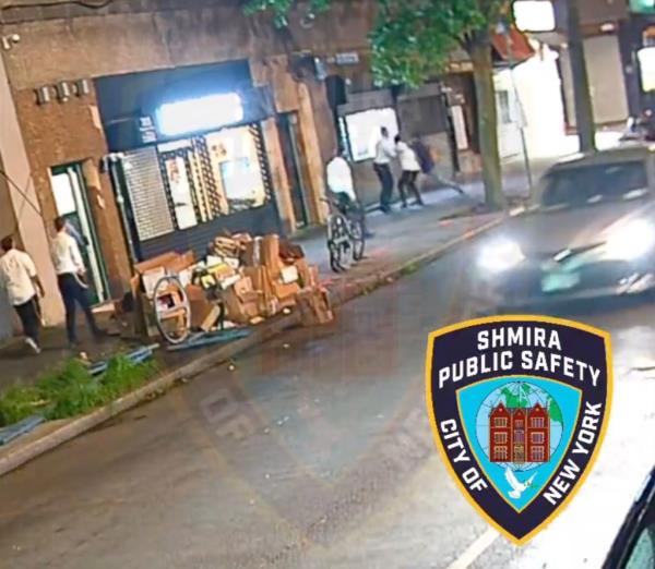 Surveillance footage of a NYC street with several men tussling on the far side of the sidewalk.