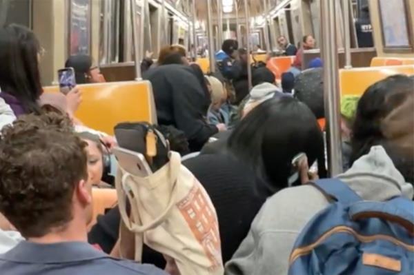Riders cowering after shots rang out on the subway.