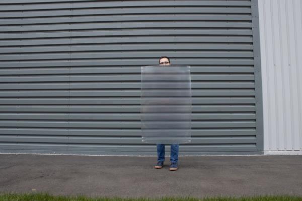 Man hiding behind invisibility shield 