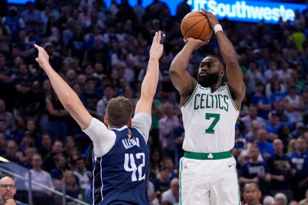 Boston Celtics guard Jaylen Brown (7) shoots against Dallas Mavericks forward Maxi Kleber (42) during the second half in Game 3 of the NBA basketball finals, Wednesday, June 12, 2024, in Dallas.