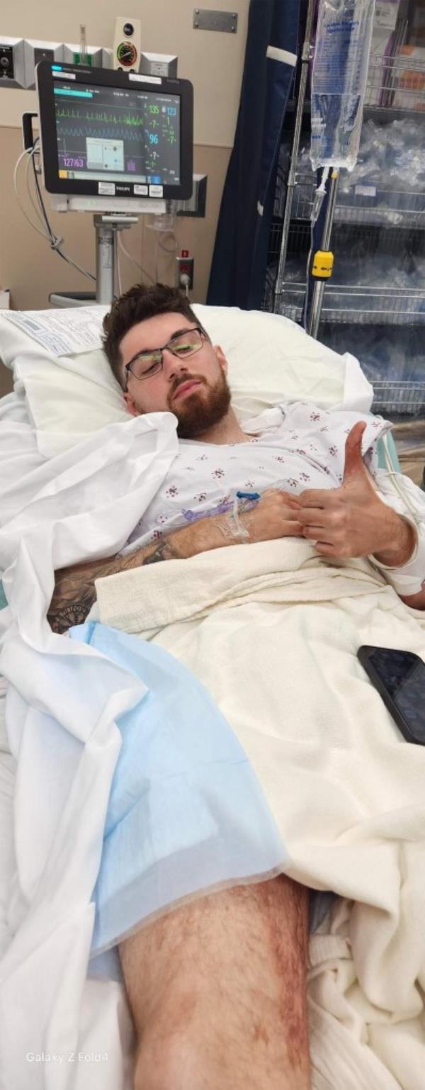 Gabriel Eslami in a hospital bed recovering from a gunshot wound from Saturday's attack.