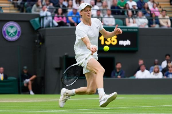 Jannik Sinner of Italy plays a forehand return to Ben Shelton of the United States during their fourth round match at Wimbledon.