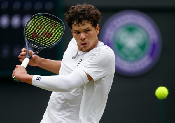 Ben Shelton of the U.S. in action during his fourth round match against Italy's Jannik Sinner.