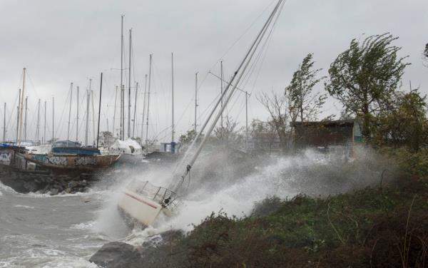 A sailboat smashing o<em></em>nto the rocks at City Island on Oct. 29, 2012.