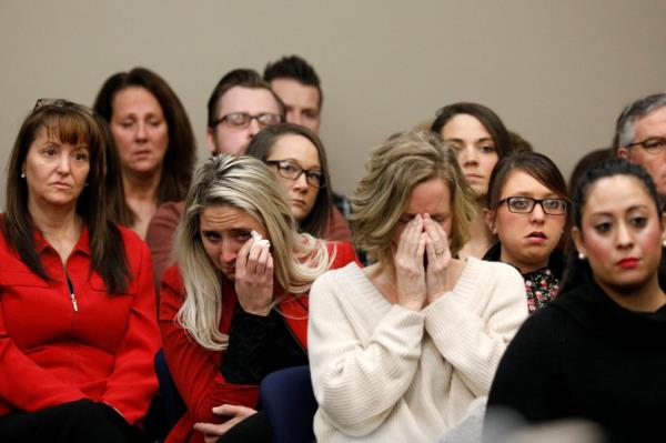 women crying in court