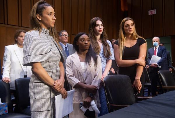 U.S. Olympic gymnasts Aly Raisman, Simone Biles, McKayla Maro<em></em>ney and world champion gymnast Maggie Nichols standing.