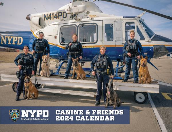 Police officers shown with their canine NYPD members on the calendar cover.