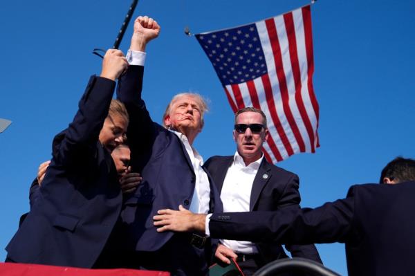 Republican presidential candidate former President Do<em></em>nald Trump is surrounded by U.S. Secret Service agents at a campaign rally, Saturday, July 13, 2024, in Butler, Pa. 
