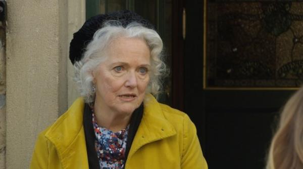 Mary outside in the village in Emmerdale