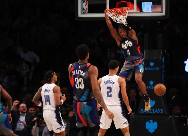 Dennis Smith Jr. slams home a dunk during the Nets' victory.