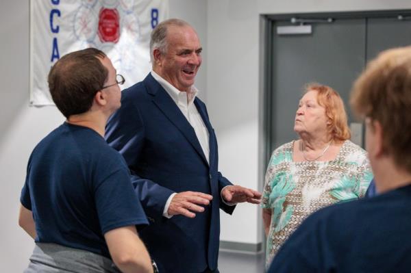 U.S. Rep Dan Kildee mingling with supporters at Kristen McDo<em></em>nald Rivet's campaign watch party on August 6, 2024, in Saginaw, Michigan