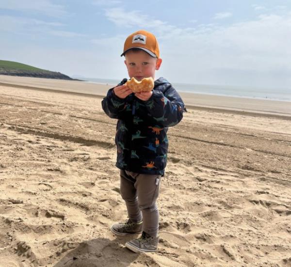 One Michelle Morgan Davies' on a sandy beach.