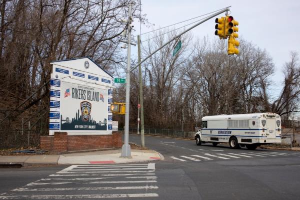 NY Department of Corrections bus driving towards the entrance of Rikers Island on January 15, 2022