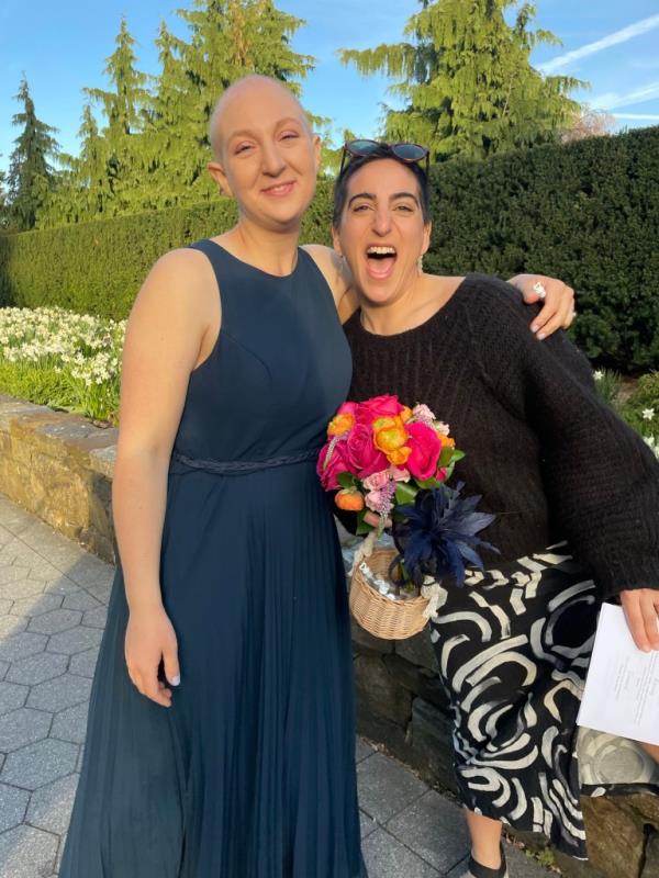 elizabeth laberge, bald and in a sleeveless dress, poses for aphoto with her arm around ibrahim