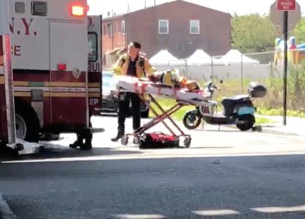 Firefighters bring one of the kids to the hospital.