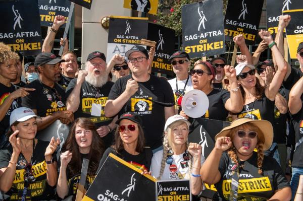 SAG-AFTRA's strike began in July alo<em></em>ngside the Writers Guild of America (WGA) who were already campaigning for an increase in ba<em></em>se pay and residuals in the streaming-TV era as well as protections from being replaced by AI. 