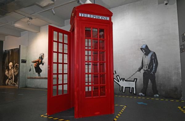 Red telephone booth at the Bansky Museum