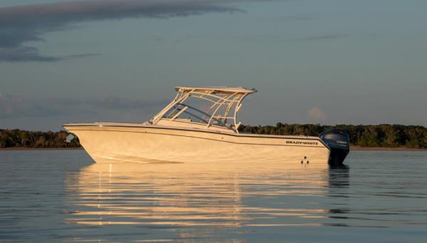 A white Freedom 275 boat on the waterr