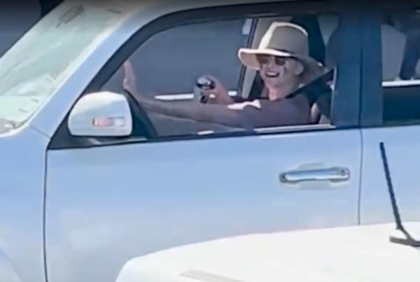 A video of Schneider recklessly driving around the shopping center with patrol cars hot on her tail shows the alleged drunk driver circling the parking lot at an alarming speed with what appears to be a drink in her hand as o<em></em>nlookers try to keep their distance from the mayhem. 