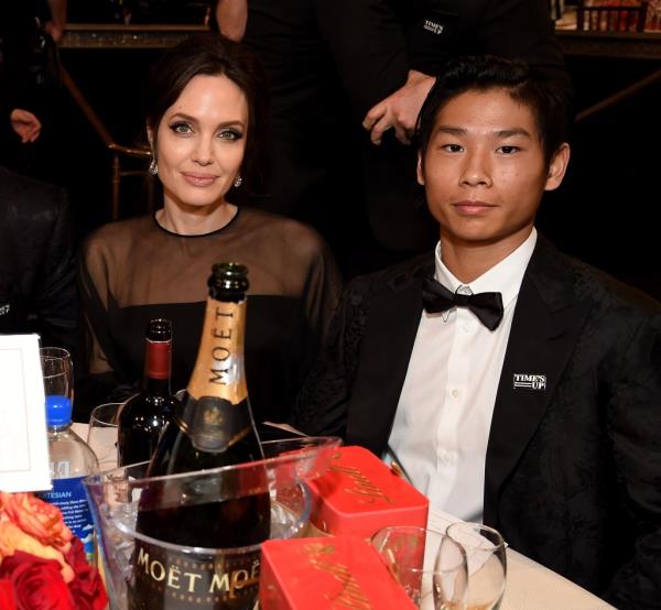 Angelina Jolie (L) and Pax Thien Jolie-Pitt attend the 75th Annual Golden Globe Awards held at The Beverly Hilton Hotel on January 7, 2018 in Beverly Hills, California.