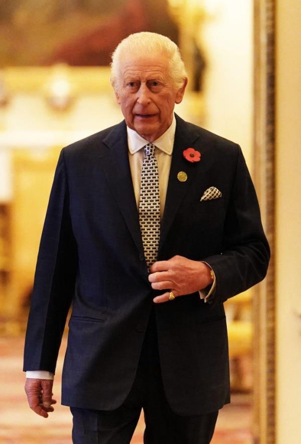 Britain's King Charles III walking in Buckingham Palace before attending an Internatio<em></em>nal Sustainability reception on November 6, 2024.