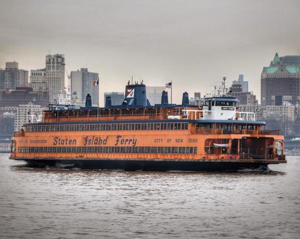Staten Island Ferry boat with Manhattan skyline in background. 