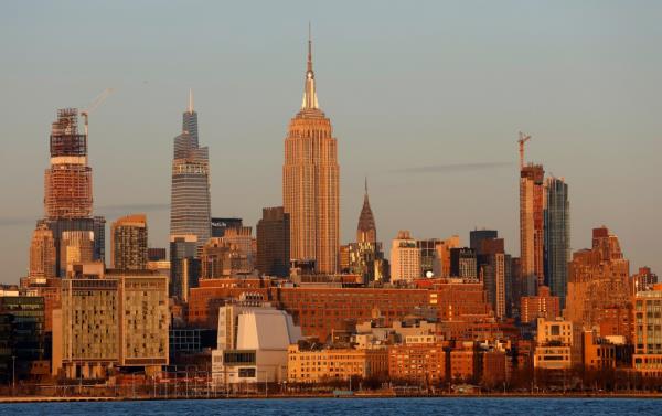 The Empire State Building stands out amid the other skyscrapers. 