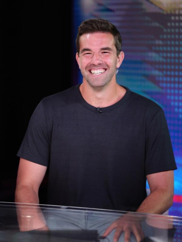 Billy McFarland smiling at camera during his visit to 'Jesse Watters Primetime' at Fox News Studios in New York City, August 2023