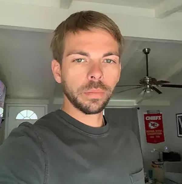 A photo of Clayton McGeeney in a green shirt looking at the camera.