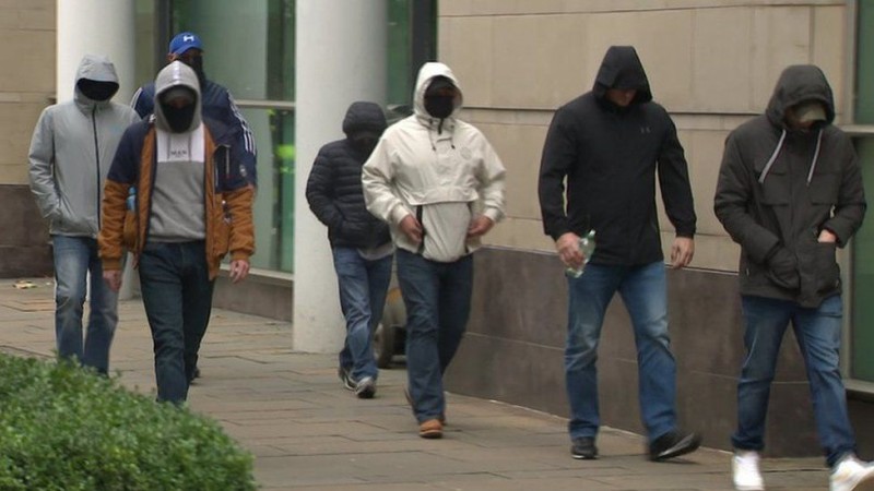 Masked men outside Laganside Courts