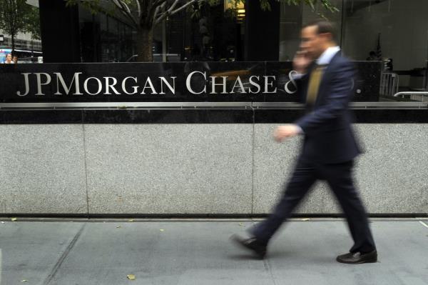 A man walking past the JP Morgan Chase World Headquarters on Park Avenue in New York, July 13, 2012