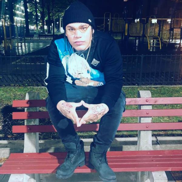Pena sitting on a park bench