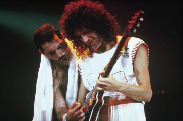 Freddie Mercury and Brian May of Queen performing live on stage in Australia, with Brian May playing guitar