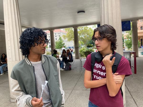 Two freshman students discuss their misgivings with Kamala Harris in the University of Pittsburgh freshman quad.