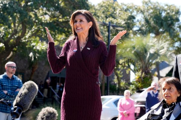 Nikki Haley gestures as she speaks with reporters after casting her vote in South Carolina's Republican presidential primary on Saturday, Feb. 24, 2024