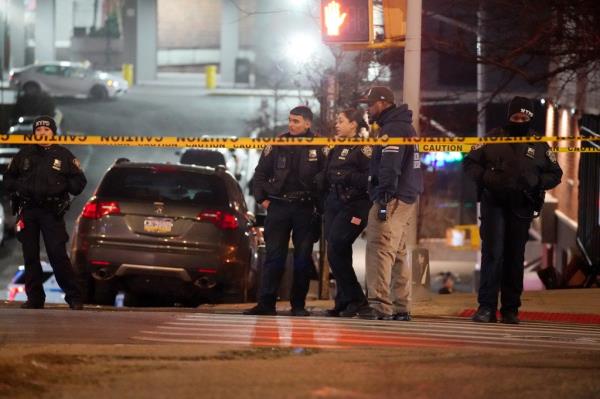 A photo of NYPD officers at the crash scene in the Bronx.