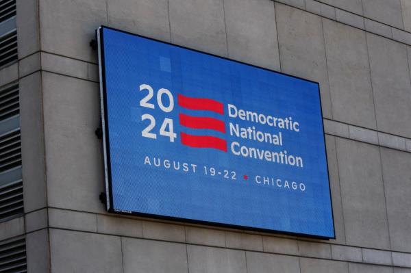An LED sign located on the United Center displays a DNC 2024 logo and information, above Pro-Palestinian protesters demo<em></em>nstrating outside the United Center, the venue for the upcoming Democratic Natio<em></em>nal Co<em></em>nvention (DNC), during a media walk through of the facility in Chicago, Illinois, U.S., May 22, 2024