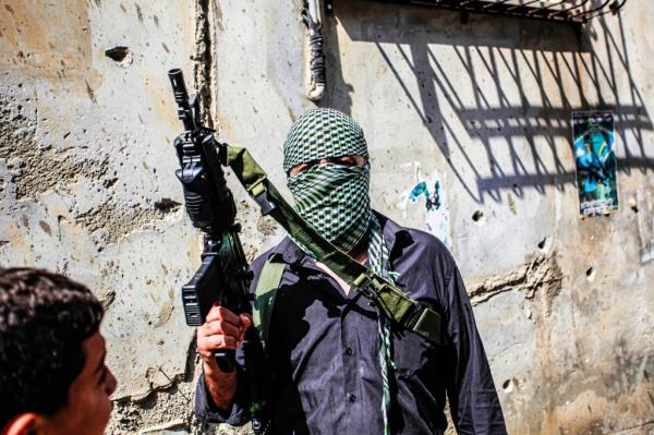 A Palestinian takes part in the funeral of 19-year-old Ahmed Al-Awawda, who was killed in clashes with Israeli forces in the Nablus area of the occupied West Bank on Oct. 8, 2023.