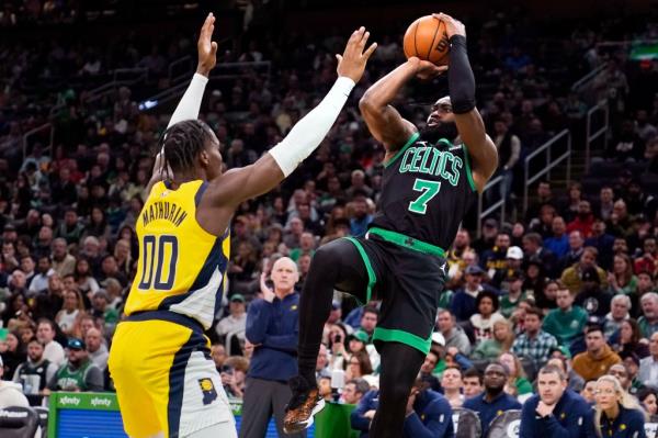 Celtics guard Jaylen Brown (7) shoots over Pacers guard Bennedict Mathurin (00) during the second half of their Nov. 1 game.