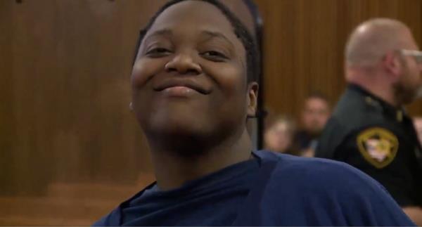 Ellis seen smiling during a court appearance in June.