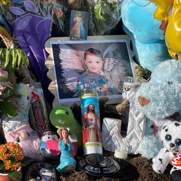 A memorial for Julian Woods outside the grocery store wher<em></em>e he was murdered.