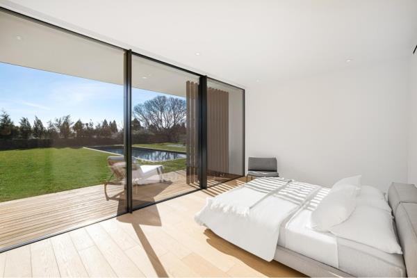 One of 12 bedrooms between both homes. 