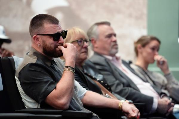 Kelce's family, from left, Kansas City Chiefs' Travis Kelce, mother, Do<em></em>nna Kelce, father, Ed Kelce, and wife, Kylie McDevitt Kelce, listens as Jason Kelce announces his retirement